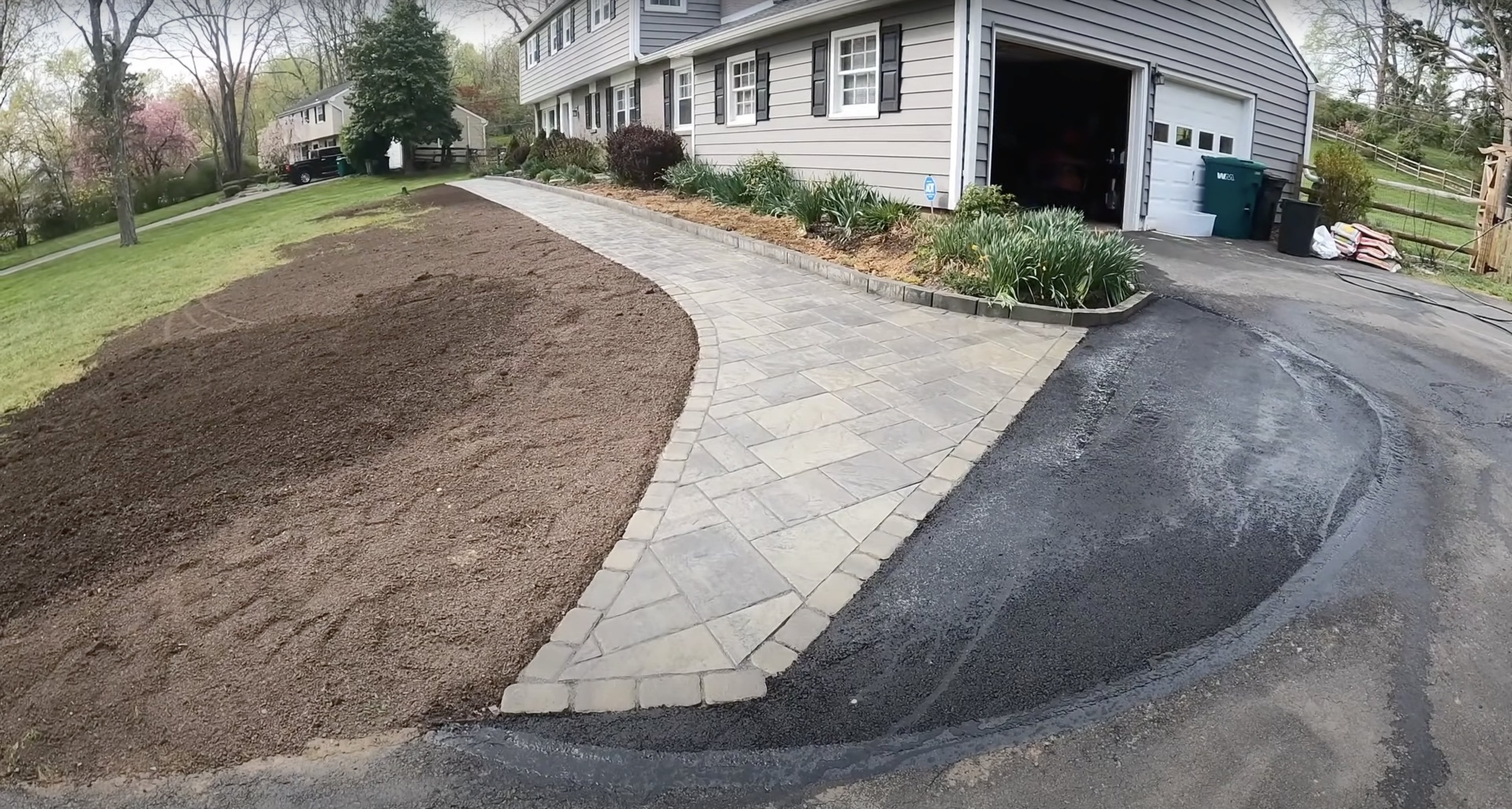 Decorative paver driveway and walkway - landscape integration by Burien Concrete Beautiful paver walkway and driveway installation with curved design and professional landscaping integration