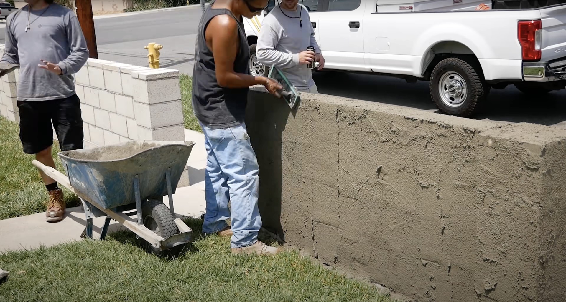 Professional concrete mixing and preparation by Burien Concrete construction team Concrete construction crew mixing and preparing concrete materials for residential foundation project